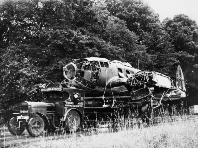 The fuselage of a Heinkel He 111 bomber, being transported by road to a scrap yard, October 1940.

