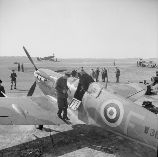 The Prime Minister of New Zealand, the Rt Hon Peter Frazer, climbs from the cockpit of a No 92 Squadron Spitfire VB at Biggin Hill on the evening of 11 July 1941.