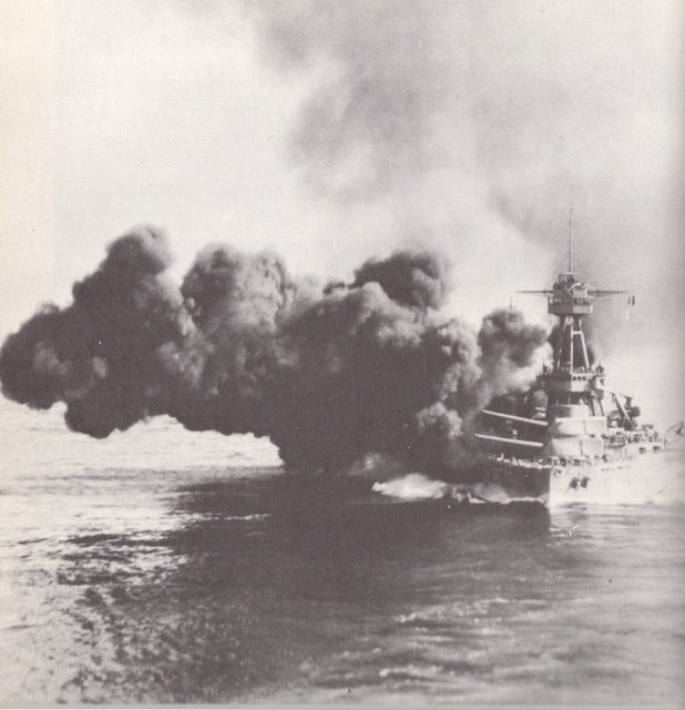 The USS Texas dreadnought class battleship fires a broadside
