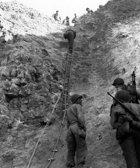 U.S. Army Rangers show off the ladders they used to storm the cliffs, which they assaulted in support of Omaha Beach landings on D-Day, 6 June 1944.