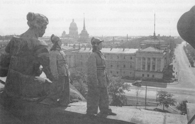 Woman of the firefighter regiment on duty on the roof of the Winter Palace in Leningrad