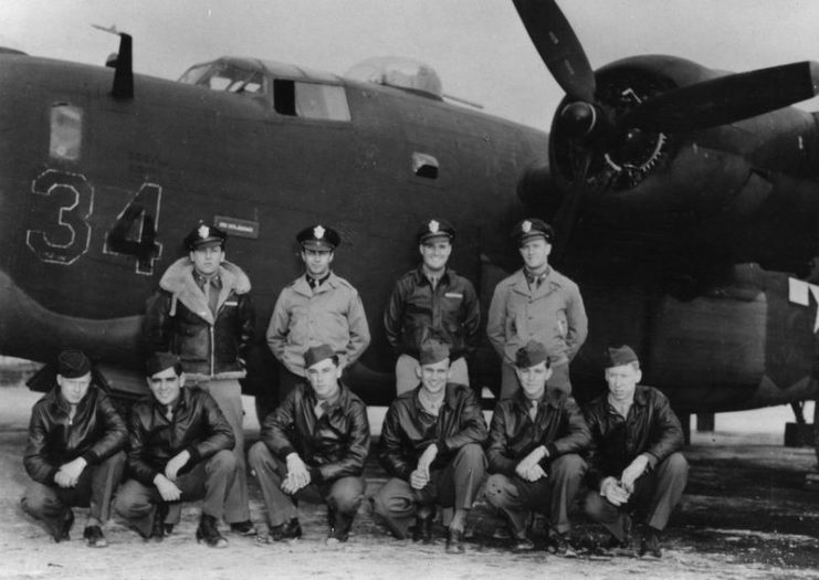 A bomber crew of the 467th Bomb Group and their B-24 Liberator (Q2-M_, serial number 42-52534) nicknamed Witchcraft.