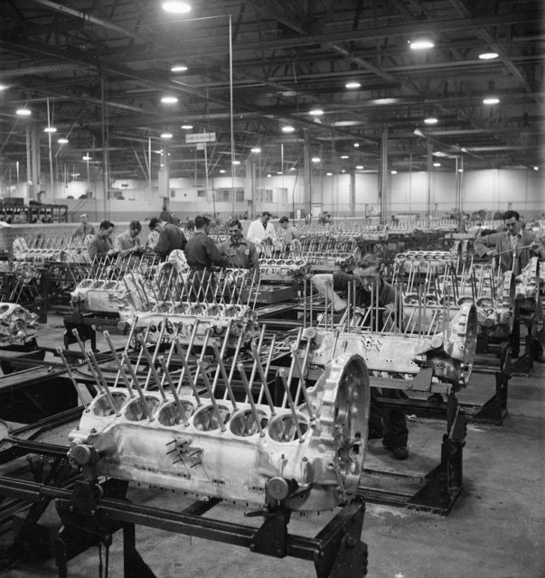 A wide view of the Crank Case assembly bay at this aircraft engine factory, somewhere in Britain. In the foreground, the cylinder studs are being fitted. These will hold the cylinder in place.