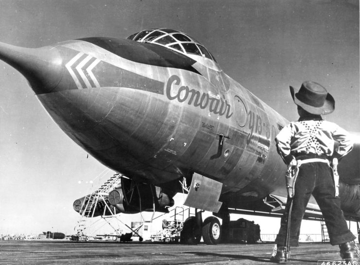 A young ‘cowboy’, the son of a member of the Air Force Flight Test Center, Edwards Air Force Base, California, looks over the Convair built YB-60 during its visit at Edwards, 1953