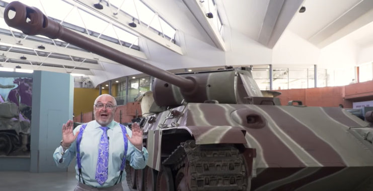 Bruce Crompton in front of The Tank Museum’s Panther tank. The Tank Museum