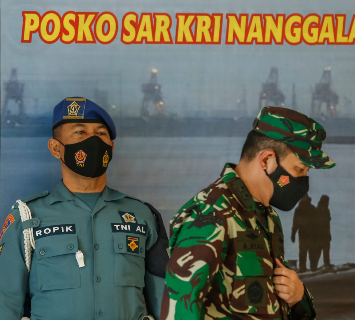 Indonesian navy officers at rescue command center