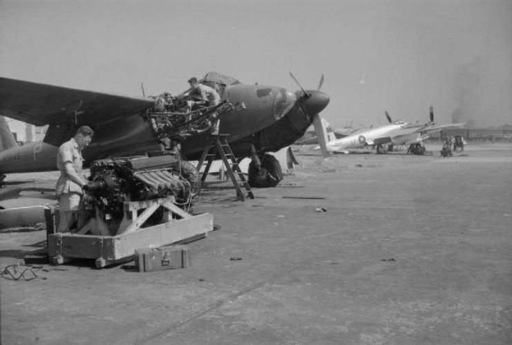 Fitters of No. 684 Squadron RAF prepare to install a new Rolls Royce Merlin 76-series engine in De Havilland Mosquito PR Mark XVI, NS645 ‘P’, at Alipore, India.