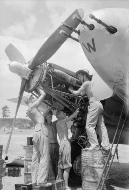 Ground crew of No. 110 Squadron RAF service the starboard engine of a de Havilland Mosquito FB Mark VI at Joari, India