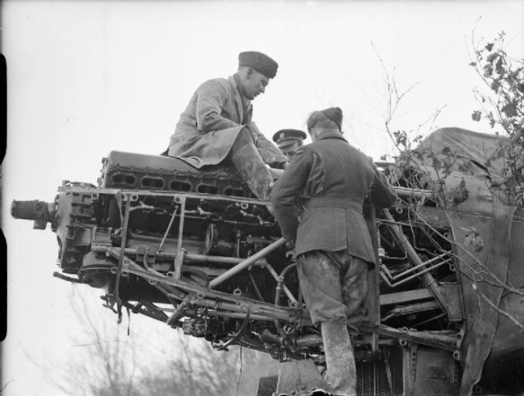 Mechanics service the Rolls Royce Merlin engine of a Fairey Battle of No. 142 Squadron RAF at Berry-au-Bac.