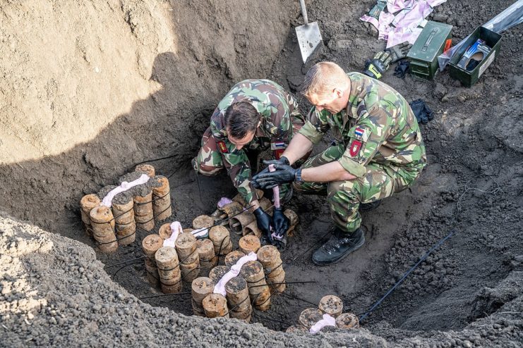 S-mines being prepared for destruction via explosion. They were planted during WWII.