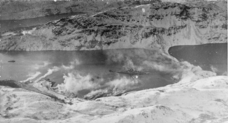 Smoke screens put up to hide the TIRPITZ drifting across the waters of the fjord though the ship has not yet been hidden from view.