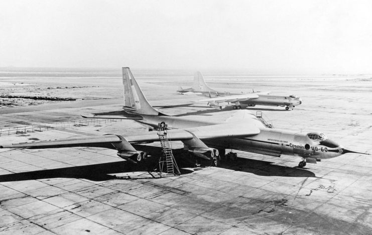 The Convair YB-60 was a derivative of the Convair B-36 with jet engines and swept wings on the ramp at Edwards Air Force Base with a standard B-36F in the background.