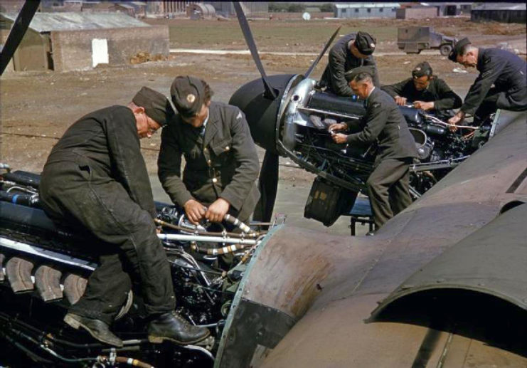 Work is done on the starboard Merlin engines of an RAF Lancaster bomber, near the technical site at Bottesford.