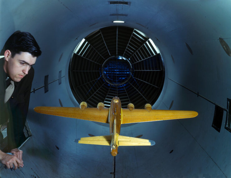 Engineer examining a model of a Boeing B-17 Flying Fortress