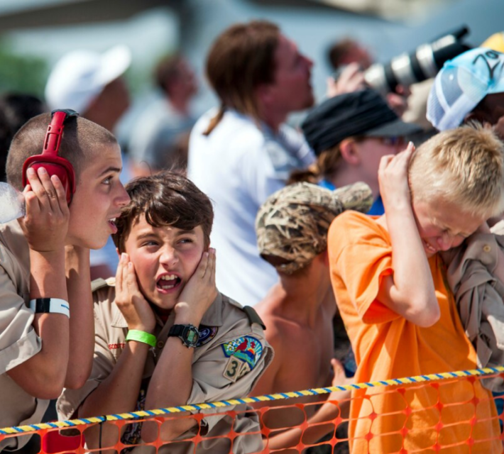 Fans react to U.S. Air Force Thunderbirds' sneak pass maneuver during the Wings Over Wayne Airshow at Seymour Johnson Air Force Base, N.C., May 16, 2015.