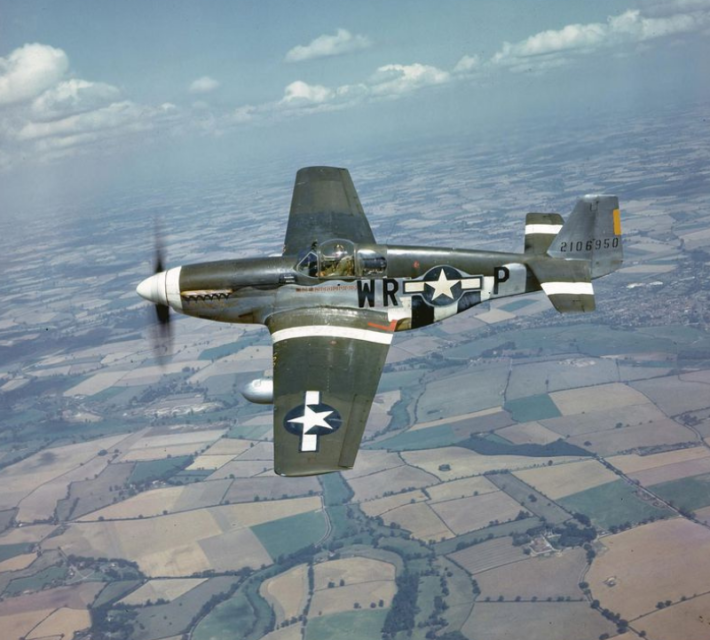 A P-51 flies over the English countryside, 1944.