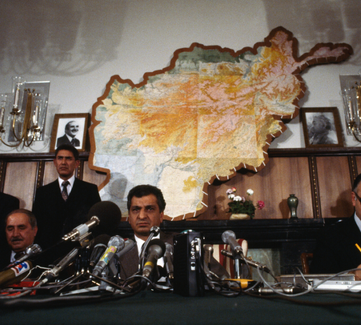 Babrak Karmal (center) attends a press conference during the Russian invasion of Afghanistan.