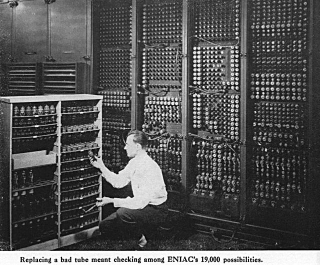 Technician changing an ENIAC tube