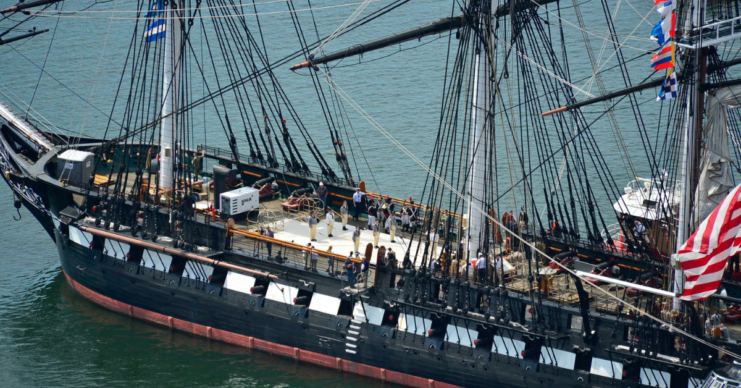  USS Constitution is tugged through the Boston harbor.