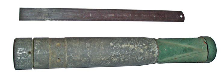 One-kilogram incendiary bomb placed beside a metal ruler