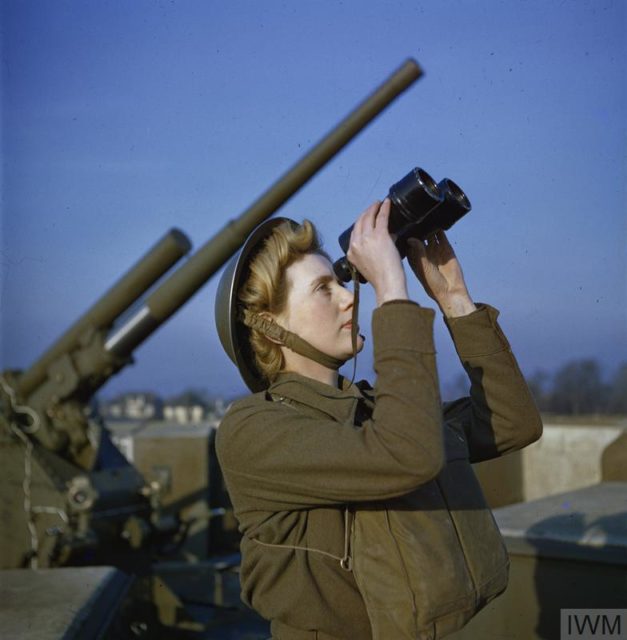 A spotter with binoculars at the anti-aircraft command post.