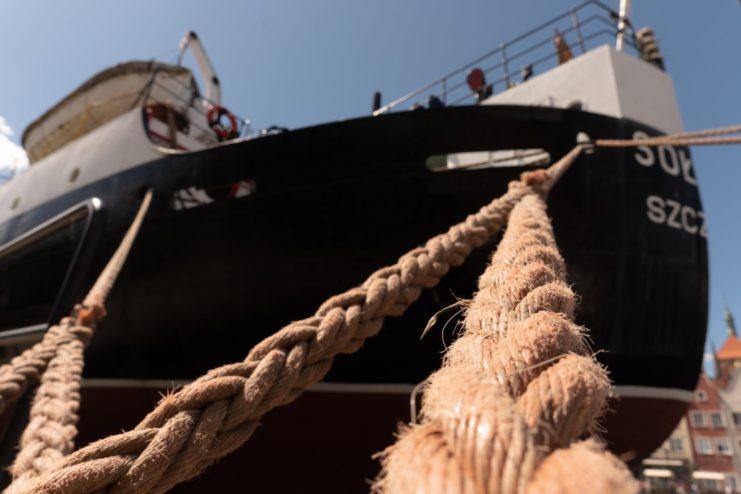 Ropes extending from the front of a ship