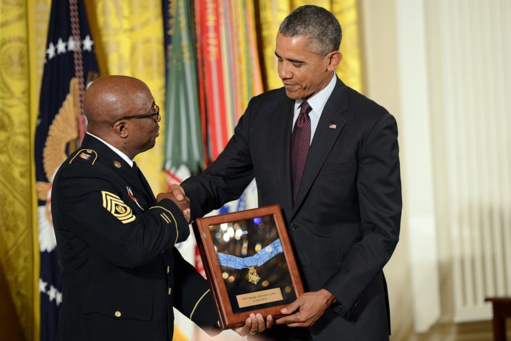 Barack Obama presenting Command Sgt. Maj. Louis Wilson with William Henry Johnson's Medal of Honor