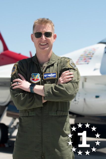 Lt. Col. Justin Elliott poses by his plane