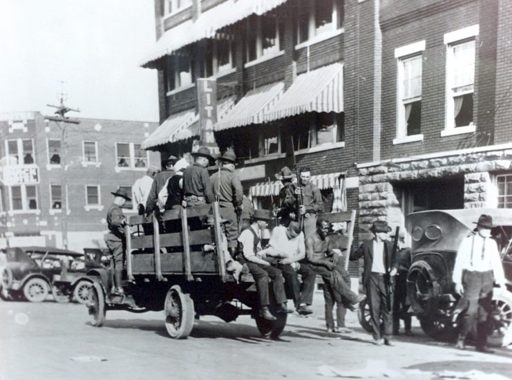 National Guard bring the wounded to get help.