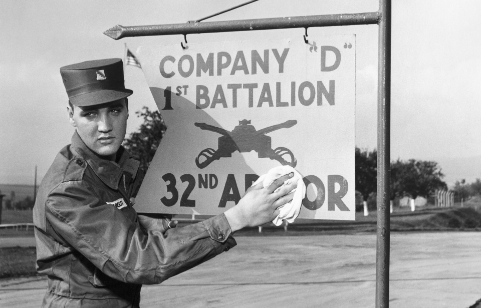 Elvis Presley poses for the camera during his military service at a US base in Germany. (Photo Credit: Vittoriano Rastelli/Corbis via Getty Images)