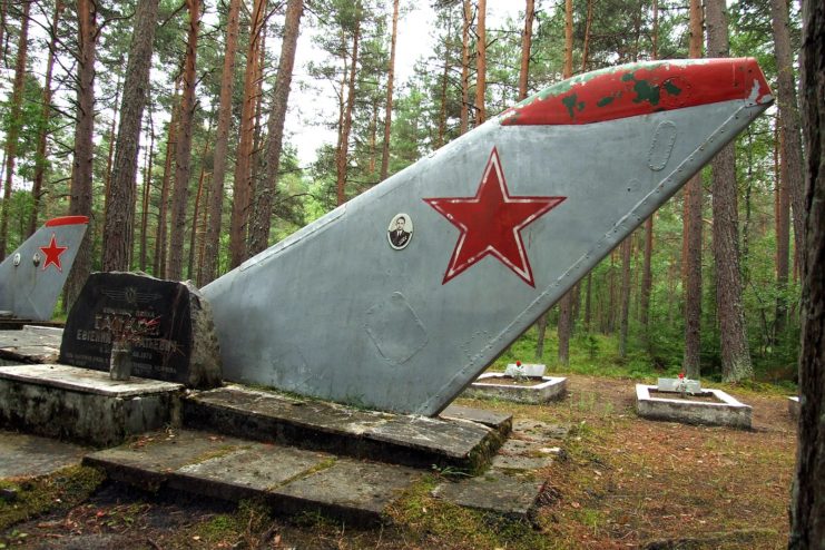 Aircraft tail sticking out of the ground at Ämari Pilots' Cemetery