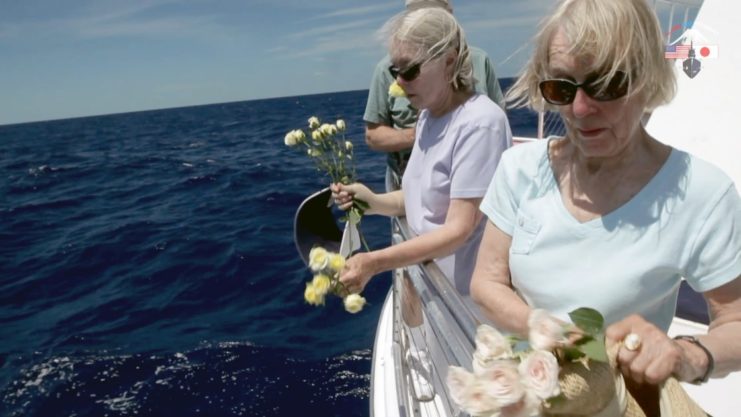 Helen Cashell Baldwin and her siblings memorializing their father above the sunken R-12.