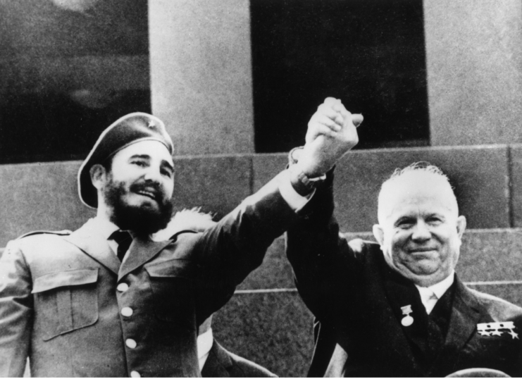 Fidel Castro and Nikita Khrushchev standing together with their hands clasped