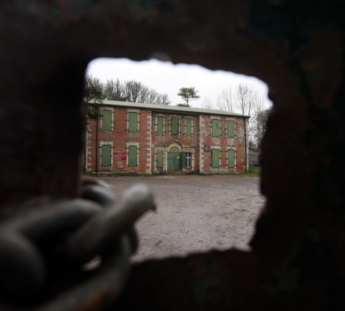 Old abandoned houses, now used for military training are seen as the 10th New Year's Eve peace vigil is held inside the 700-year-old nearby St Giles church in the village of Imber on December 31, 2011 on Salisbury Plain, England