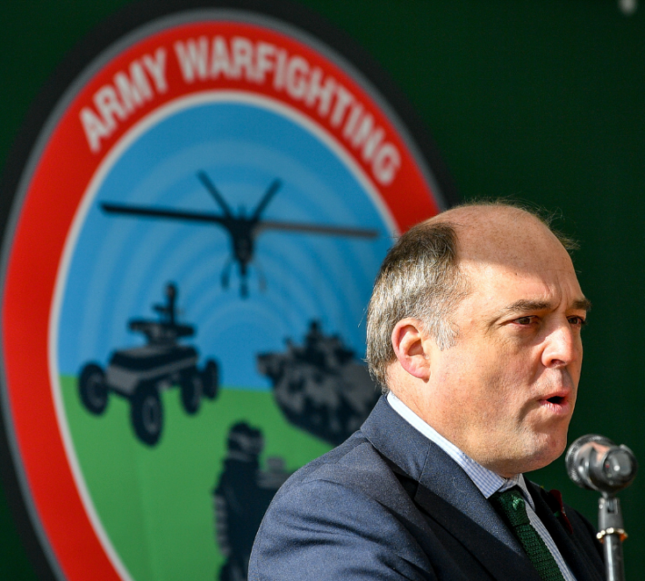 Defence Secretary Ben Wallace speaks to gathered journalists and military personnel during a visit to Salisbury Plain training area.