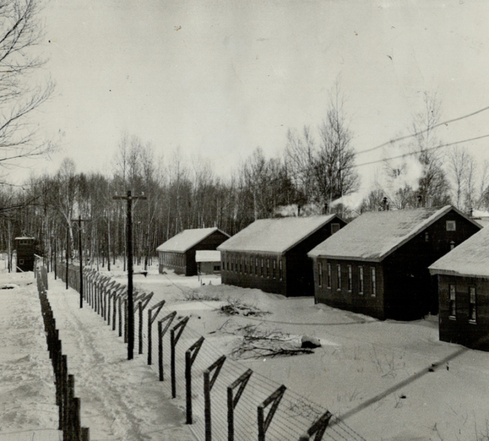 Double wire fencing features the camp-like atmosphere of the internment centre at Petawawa.