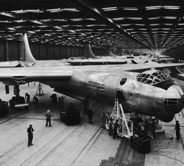 Work crews standing around a Convair B-36 Peacemaker in the middle of a factory floor