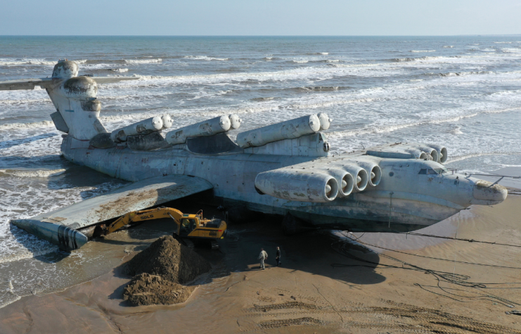 MD-160 on the beach, with waves coming up under it
