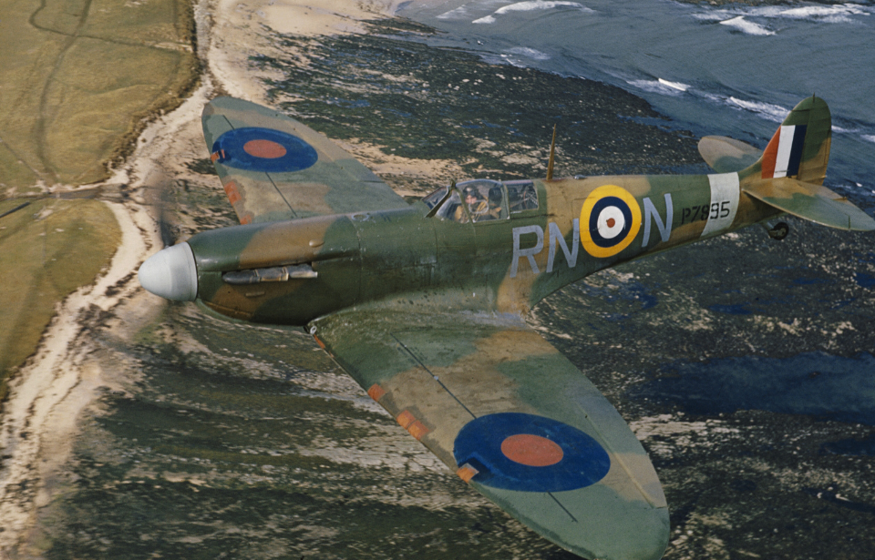 Supermarine Spitfire Mark IIA, P7895 'RN-N', of No 72 Squadron, Royal Air Force based at Acklington, Northumberland, in flight over the coast, piloted by Flight Lieutenant R Deacon Elliot. April 1941