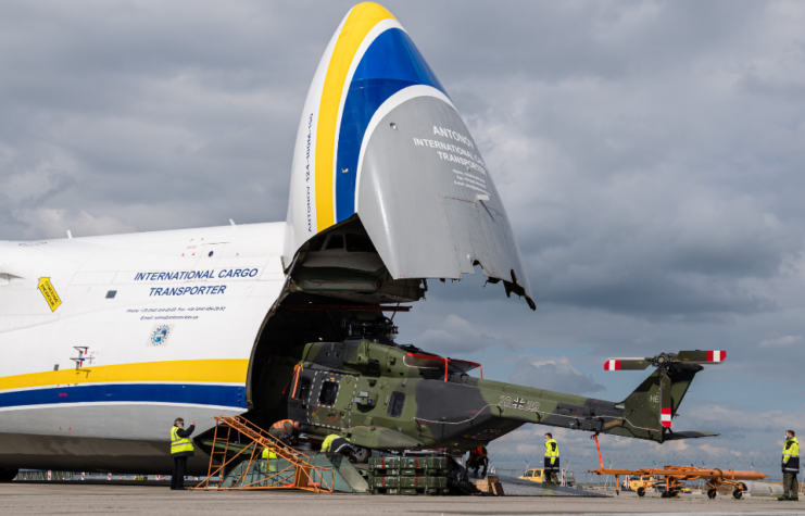 Soldiers of the Bundeswehr, Germany's armed forces, unload an NH90 transport helicopter from a plane Antonov AN-124 for military transport arriving from Afghanistan at Leizpig Airport on May 18, 2021 in Leipzig, Germany.