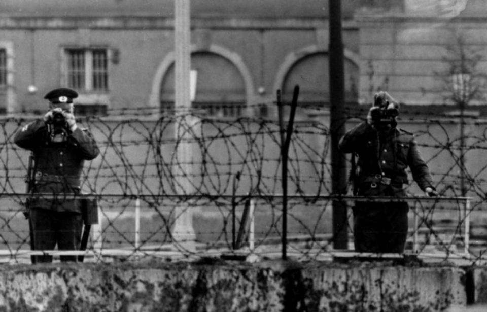 East German police guarding the Berlin Wall