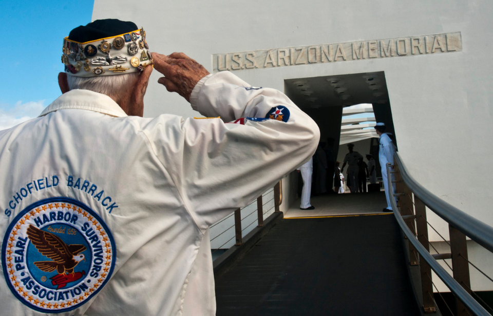 Army Sgt. (ret.) Allen Bodenlos, a Pearl Harbor survivor, salutes the Arizona memorial, 2012. (Photo Credit: U.S. Navy)