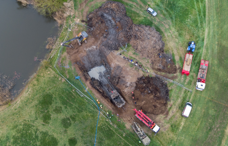 A 26-foot-long Buffalo tank is extracted from the earth in Crowland, Lincolnshire, where it has been buried for 74 years since it was brought into the village to help during heavy floods in March 1947. Sixteen of the amphibious Buffalo tanks were used to help seal the breach when a combination of heavy snow, high tides, rain and wind caused the River Welland to break its banks