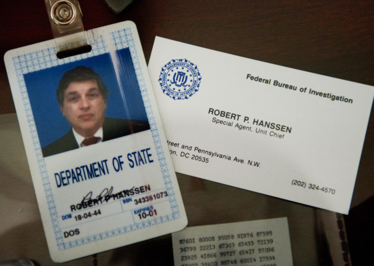 Robert Hanssen's ID and business cards laid out beside each other