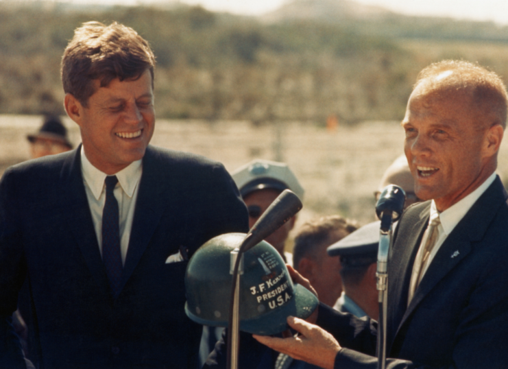 John F. Kennedy standing with John Glenn