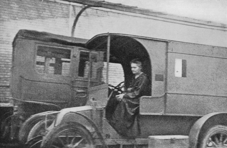 Marie Curie driving a Renault car that was converted into a mobile X-ray unit