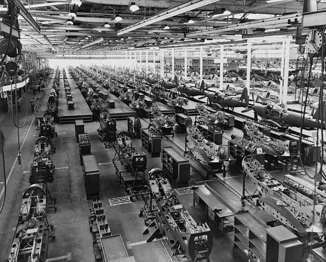 Rows of Bell P-39 Airacobras under construction on a factory floor