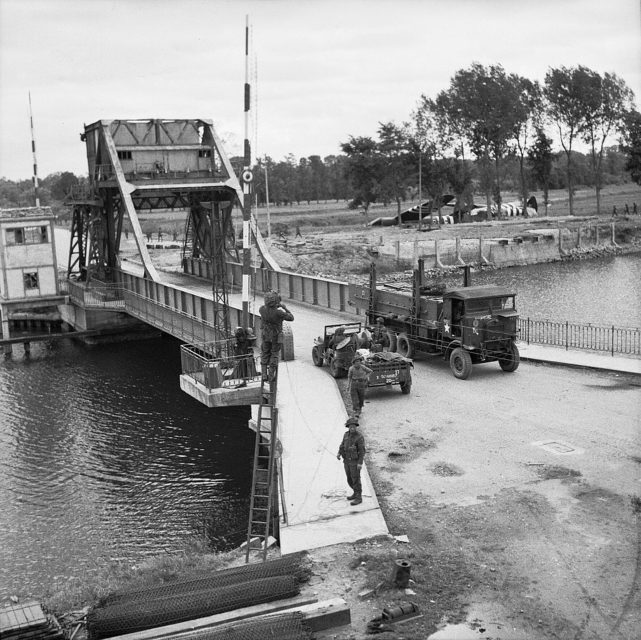 Military vehicles driving across Pegasus Bridge