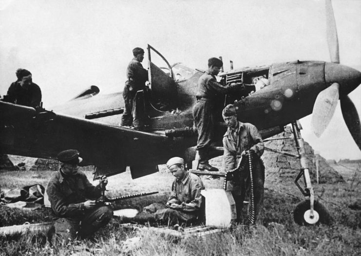 Russian aviators sitting around a Bell P-39 Airacobra