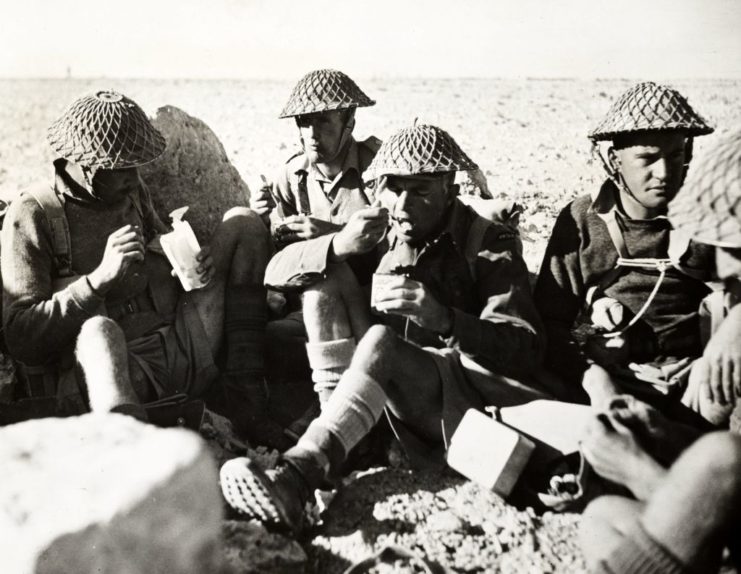 Charles Upham eating with other members of the New Zealand Division